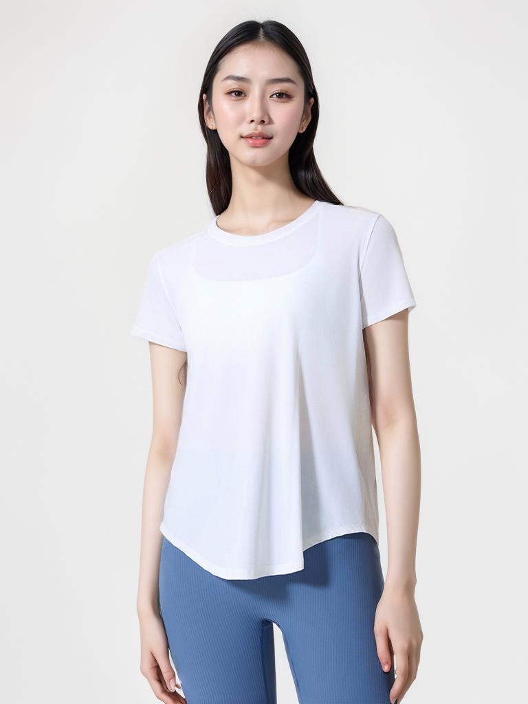 Woman wearing a white Aero Flow Active Tee with a round neck and short sleeves, paired with blue leggings