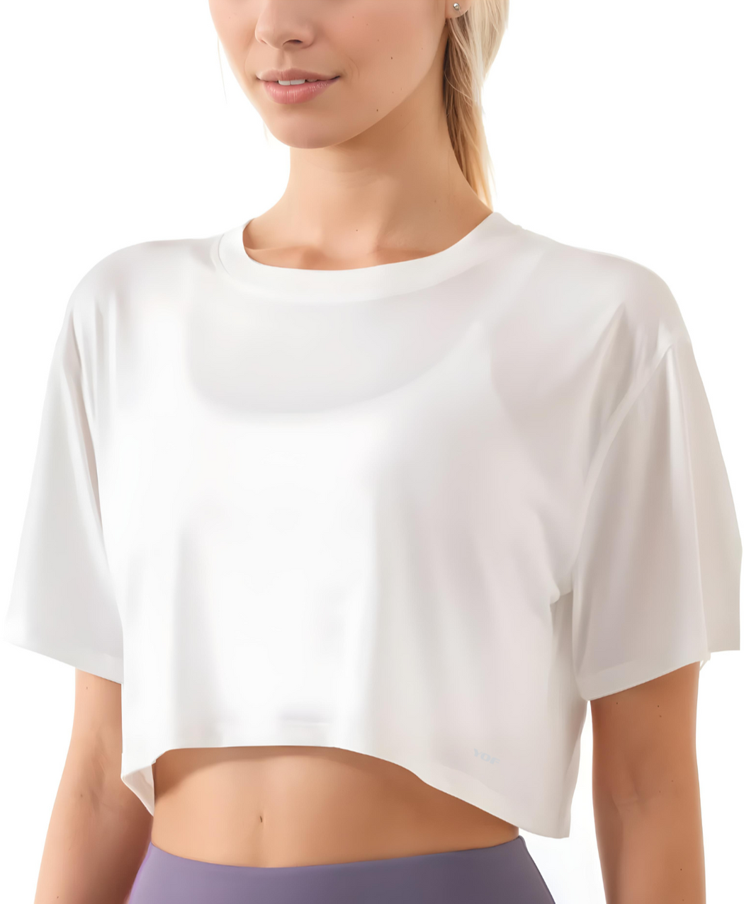 Person wearing a white crop top on a white background