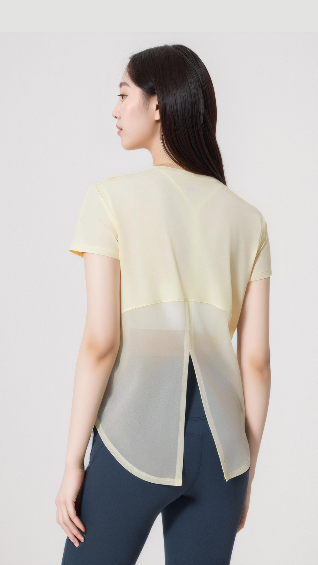 Aero Flow Active Tee in light yellow with back slit for ventilation, breathable and stylish activewear top.