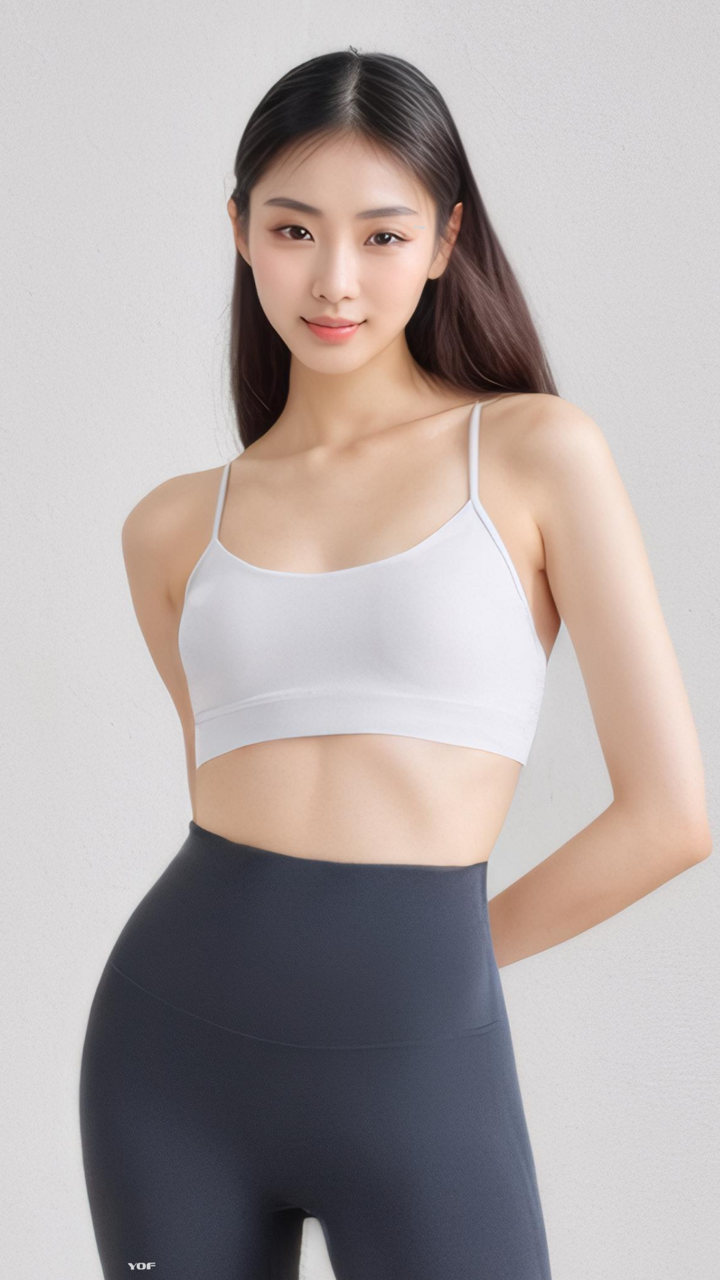 Woman wearing a white AeroFlex Strappy Bra with thin straps and a smooth nylon-spandex fabric for light workouts.