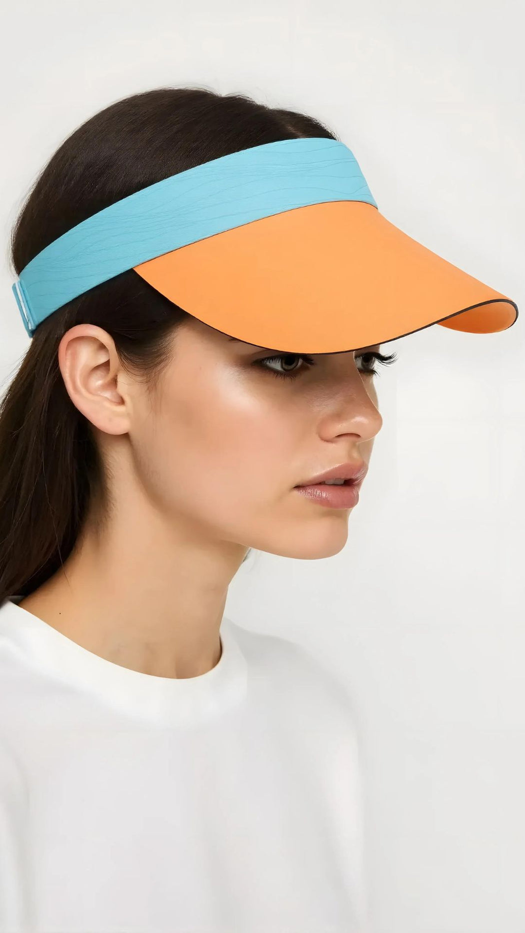 A close-up side view of a woman wearing the AeroCool Sun Visor – Adjustable Lightweight UV Protect UPF50+ in orange and blue.